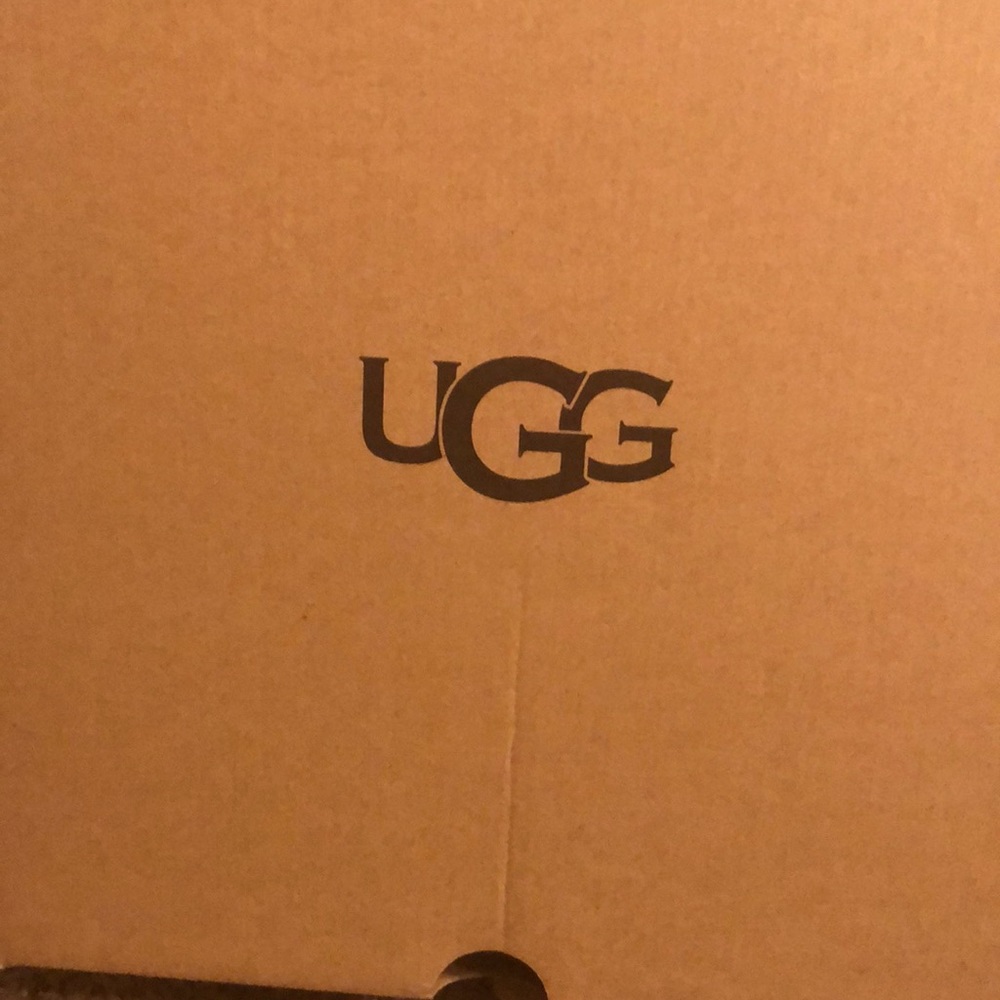 UGG silver sneakers. Size 9. Too tight for my feet. Never been worn.